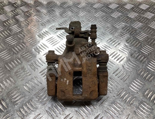 Суппорт задний левый Nissan Primera II (P11) 1996-2002  Nissan Primera Primera II (P11) 1996-2002