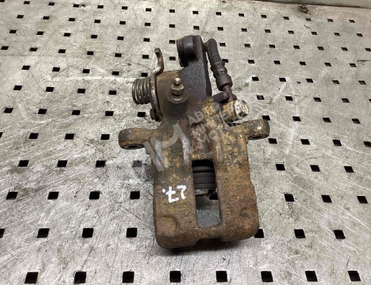 Суппорт задний левый Nissan Primera II (P11) 1996-2002  Nissan Primera Primera II (P11) 1996-2002